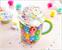 Care Bears Allover Print Ceramic Mug With Rainbow Handle | Holds 20 Ounces